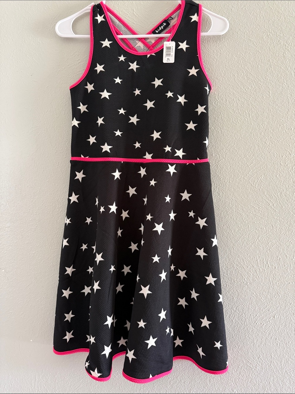 kidpik Black Star Print Dress with Pink Trim. Ptp 14”. Length 33”